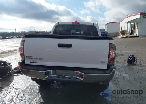 2015 Toyota Tacoma Base V6 z USA, uszkodzony, nr VIN 3TMLU4ENXFM207224